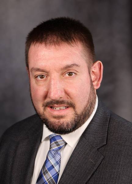 A person in a suit

Description automatically generated with low confidence